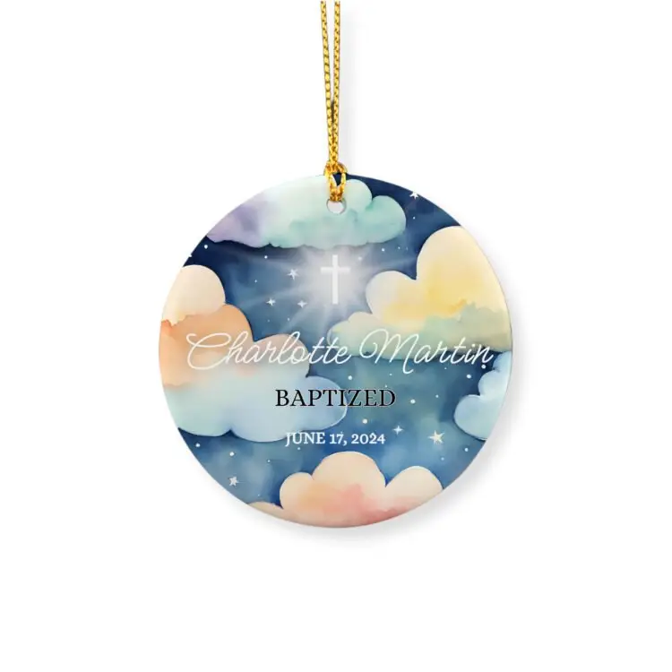 Personalized baptism ornament for little girls featuring a drawing of clouds in the night and the light of god coming through the cross, a name and the baptism date