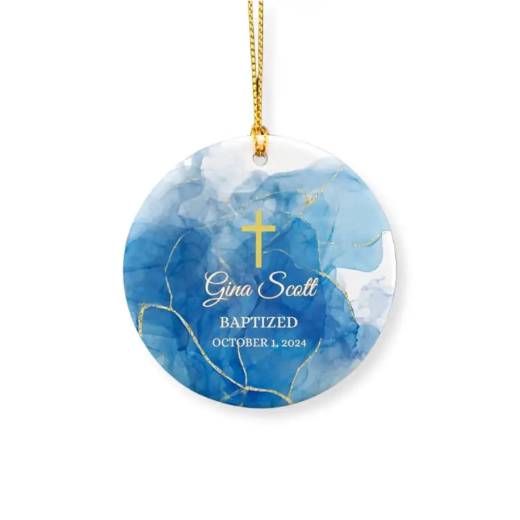 Personalized baptism ornament featuring a marble blue stone with golden lines, a gold cross, a name and the baptism date