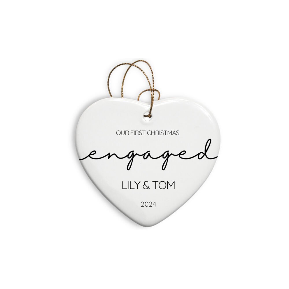 Personalized engagement heart ornament featuring the word "engaged" and first names of the couple and date