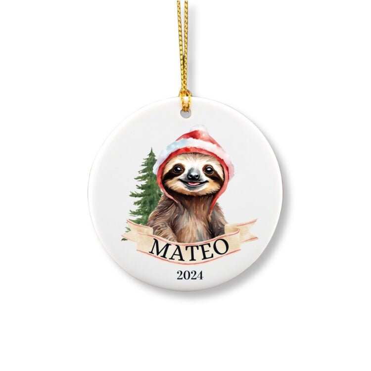 Personalized sloth Christmas ornament with name in front of a Christmas tree