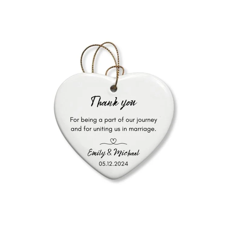 Personalized-heart-ornament-for-wedding-officiant-featuring-a-kind-note-and-the-name-of-the-married-couple-and-wedding-date