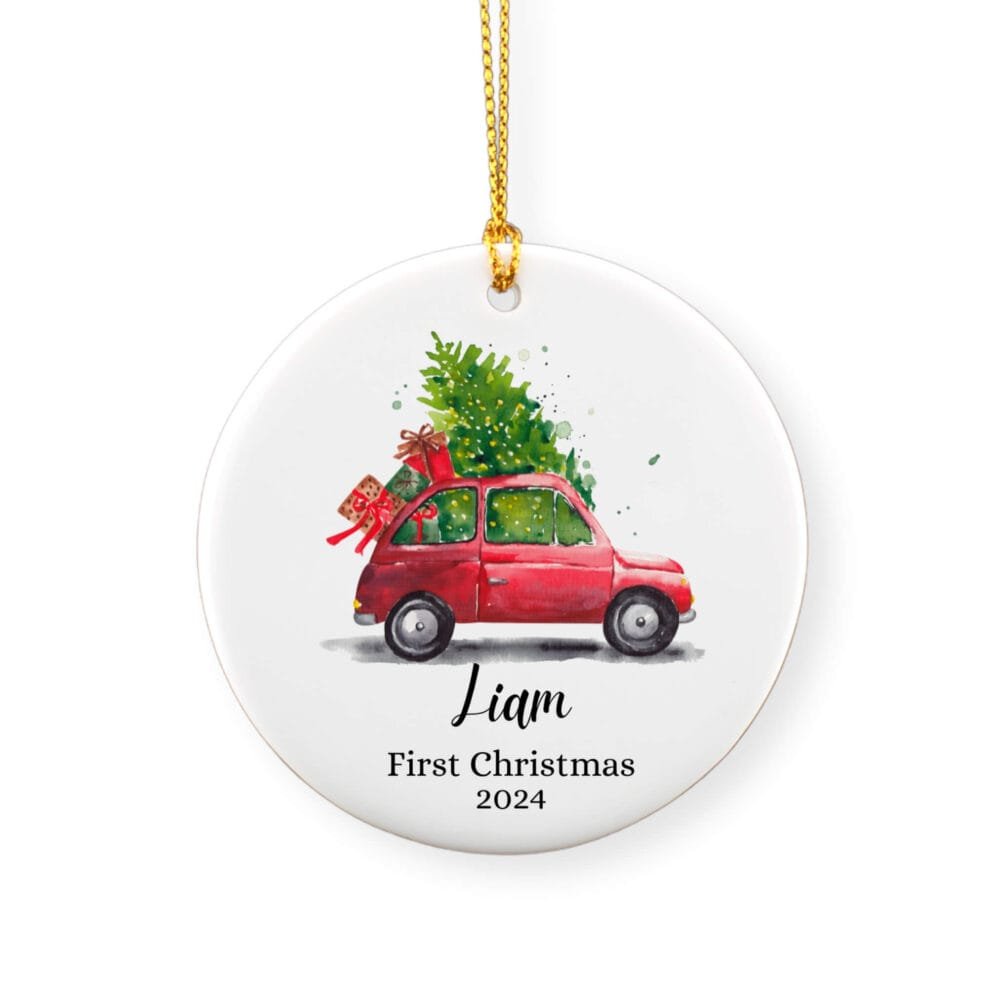 Personalized Christmas ornament for baby boy featuring a watercolor red car carrying a Christmas tree and a baby boy name and year